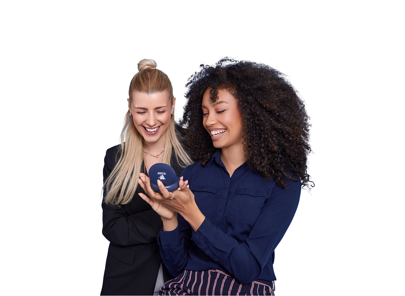 Two women smiling with clear aligners and Dr Clear Aligners case on bed