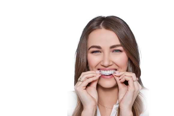 Smiling woman with traditional metal braces for orthodontic correction